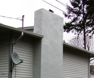 Stucco Chimneys in Roofing by Bruce